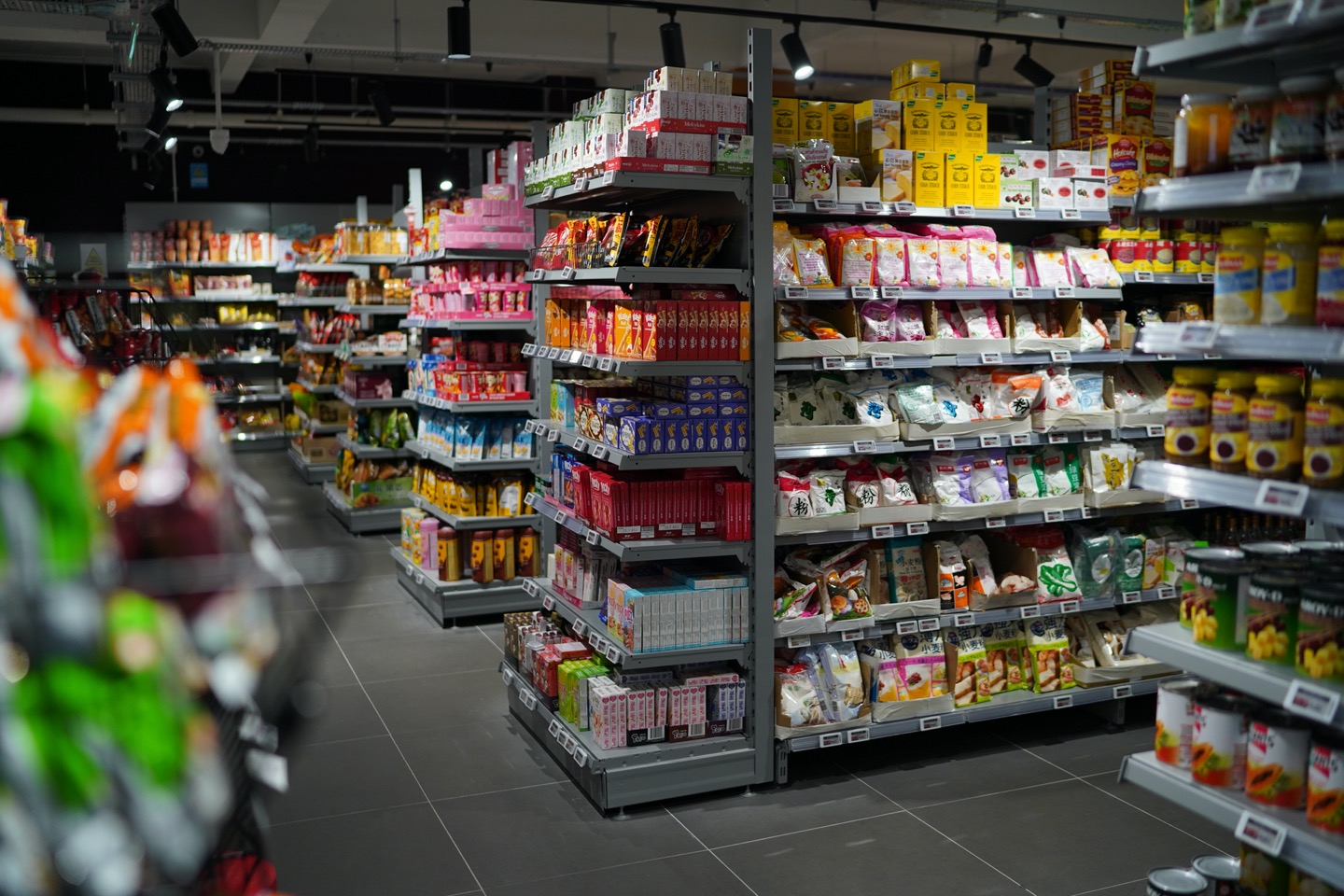 Shelves of soy sauce and seasoning bottles in a Matthew's Foods store